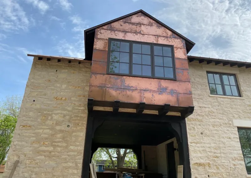 Copper metal panel facade on a stone building for Metal Roof Coating in Moab